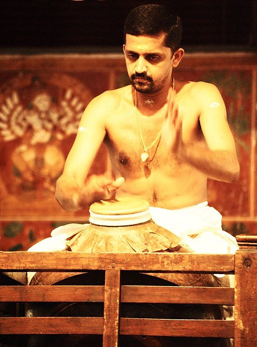 Artist Playing Mizhavu for Chakyar Koothu
