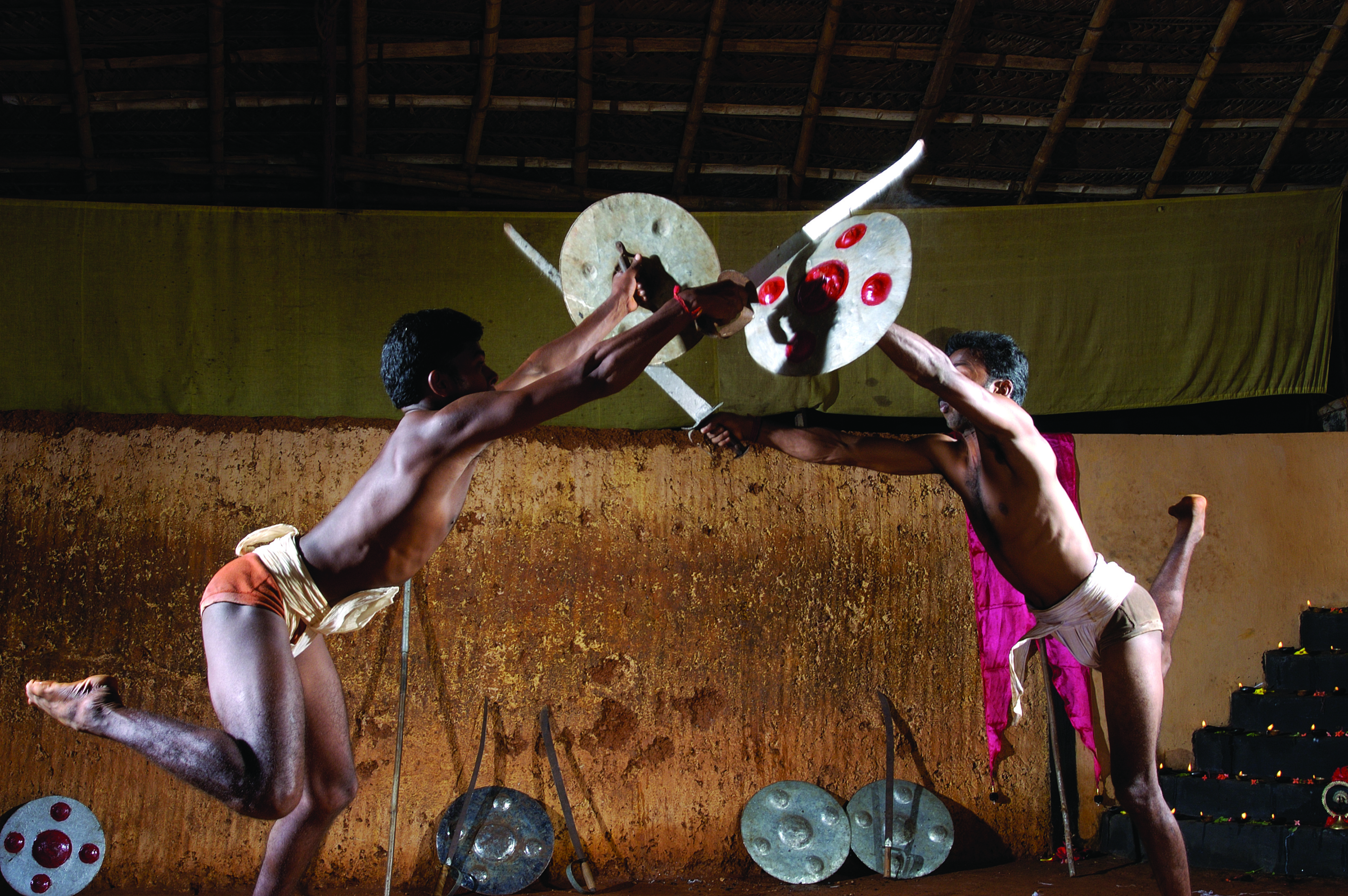 Kalaripayattu demonstration — Kerala's ancient martial art in dynamic performance, showcasing the extraordinary flexibility, power, and precision of this 3,000-year-old fighting science