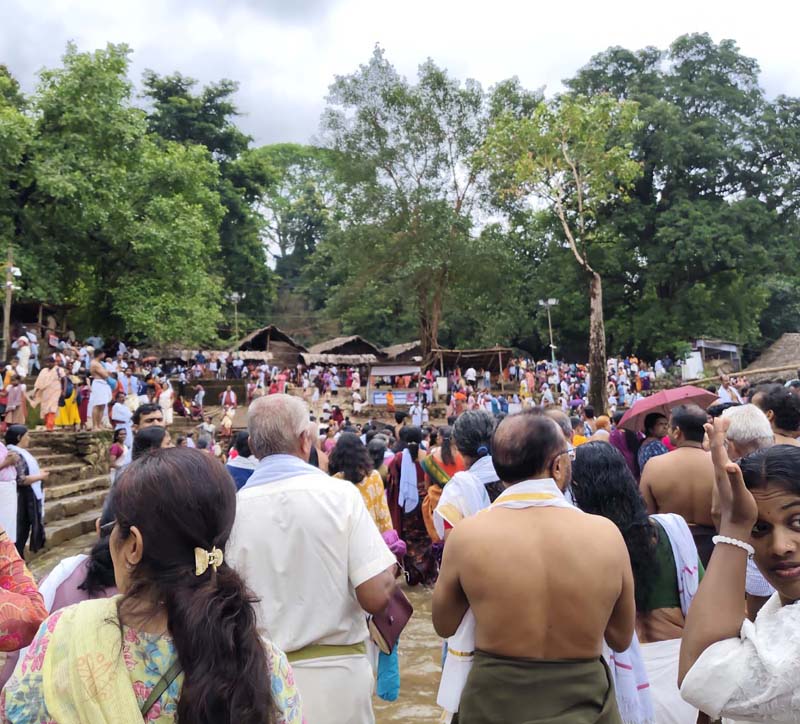 Kottiyoor Vaishakha Mahotsavam festival — the temporary Akkare Kottiyoor shrine constructed annually from bamboo, palmyra leaves, and coconut fronds in the monsoon forest of Kannur, showing the unique ephemeral architecture of Kerala's most distinctive pilgrimage where the shrine is built and dismantled every year leaving no permanent footprint on the sacred ground