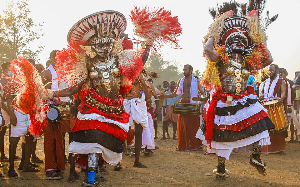 Para Poothan folk art performance in a Kerala village — the community performance tradition in which proverbs about social hierarchy, Onam, and the unchanging order of things were embedded and transmitted across generations