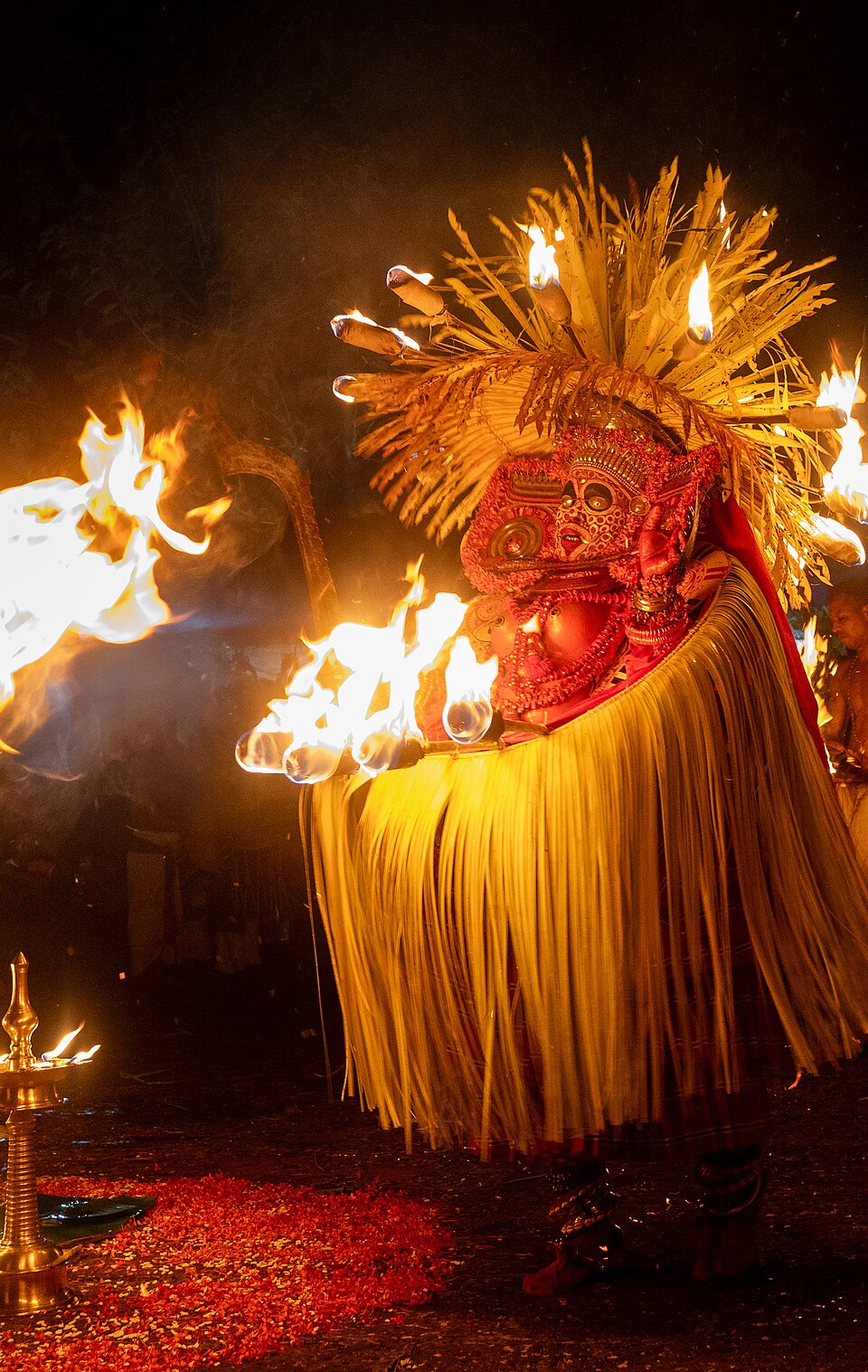 Puli Bhagavathy Theyyam — a fierce tiger-goddess manifestation featuring dramatic black and red tiger-stripe makeup and elaborate crown, one of North Kerala's most powerful female Theyyam forms