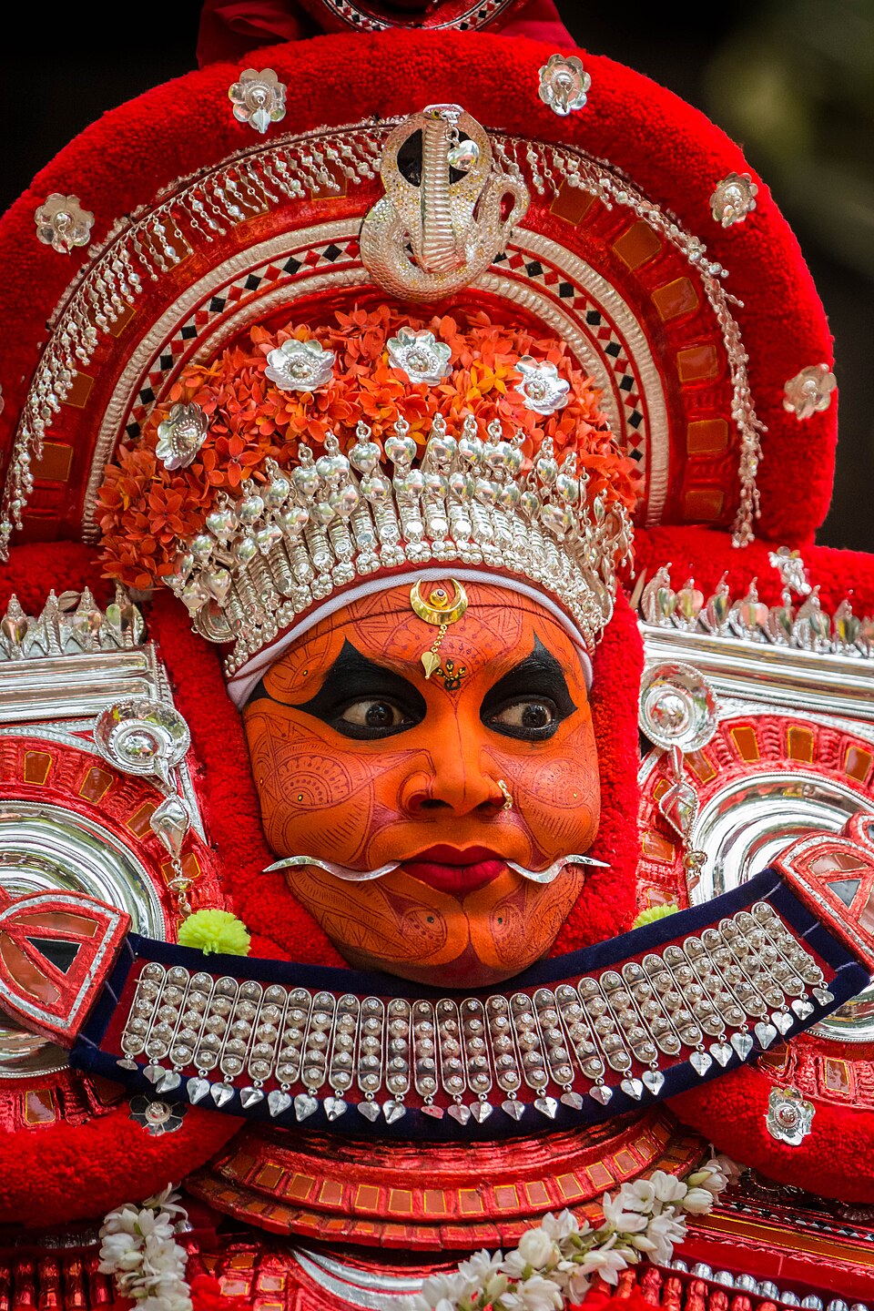 Vasoorimala Theyyam — a female deity Theyyam form associated with disease prevention and community protection, featuring elaborate golden ornaments and distinctive ceremonial costume